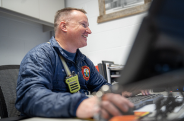 Fire chief working on computer
