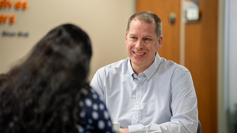 Man talking with client