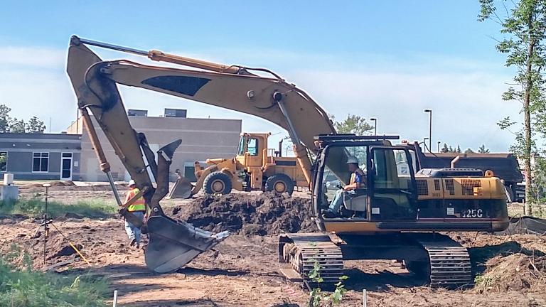 heavy equipment being used to prepare a construction site