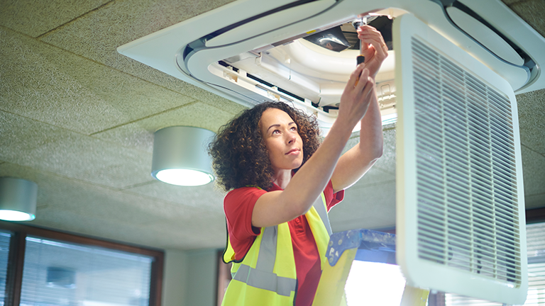 Woman working on light