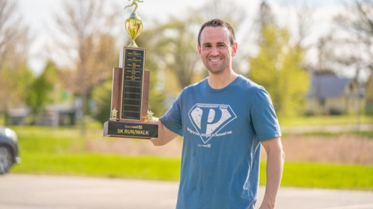 Man showing a trophy